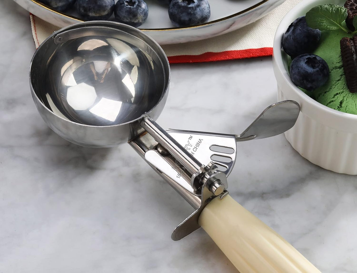 New Star Foodservice 34783 Commercial-Grade Thumb Press Food Disher/Ice Cream Scoop, 18/8 Stainless Steel, 3.75 oz, Size 10, Ivory