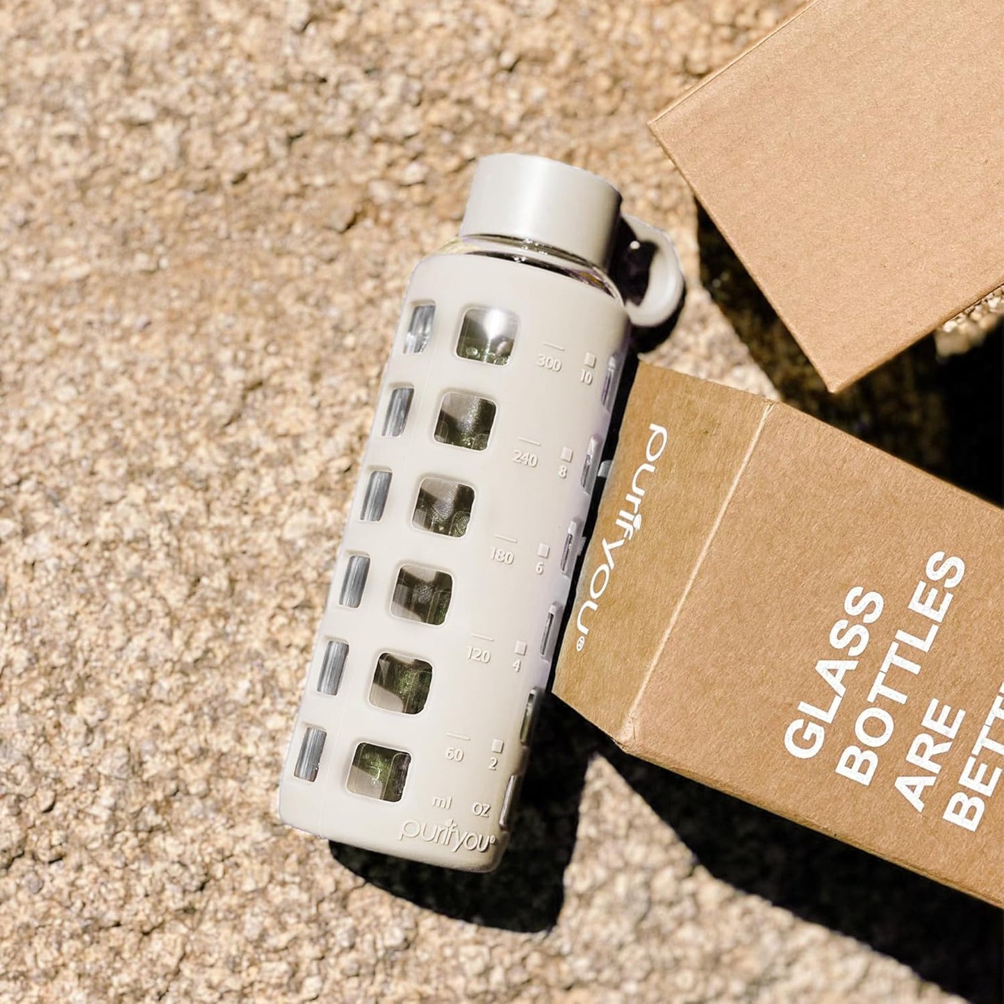 purifyou 40oz / 32oz / 22oz / 12oz Borosilicate Glass Water Bottle with Time & Volume Markers, Silicone Sleeve, Stainless Steel Lid – Reusable Glass Bottle for Water & Juice (12oz Pearled Ivory)